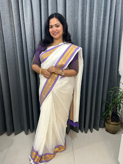 Creamish white Mulcotton saree with purple border with golden zari stripes SMC229