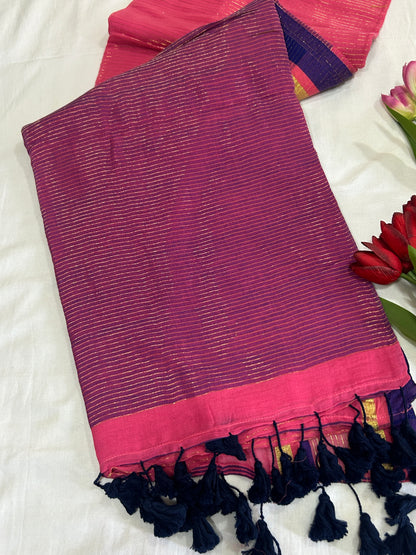 Pink color mulcotton saree with golden lines all over the body and blue and golden striped border SMC235