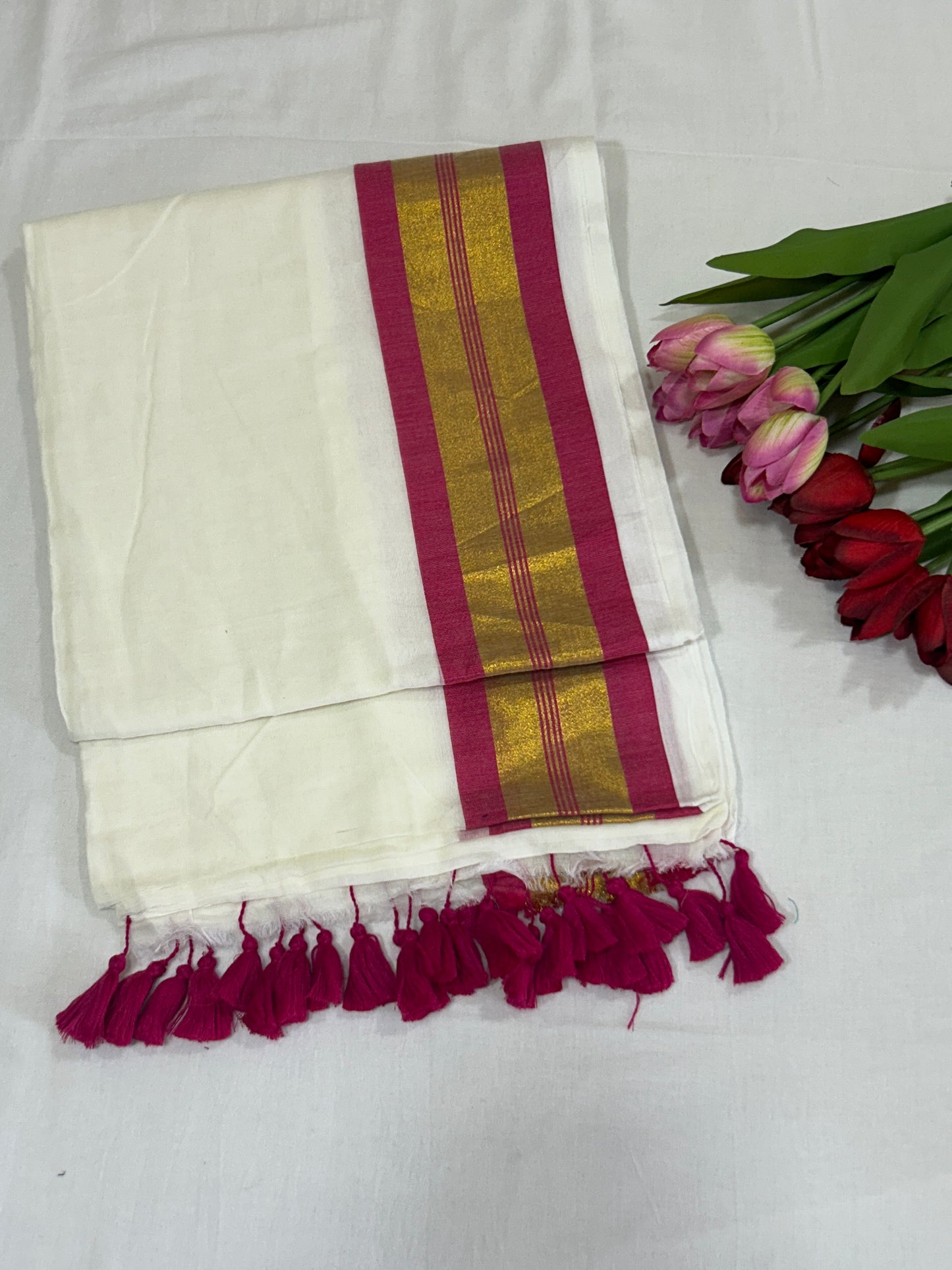 Creamish white Mulcotton saree with rani pink border with golden zari stripes SMC228