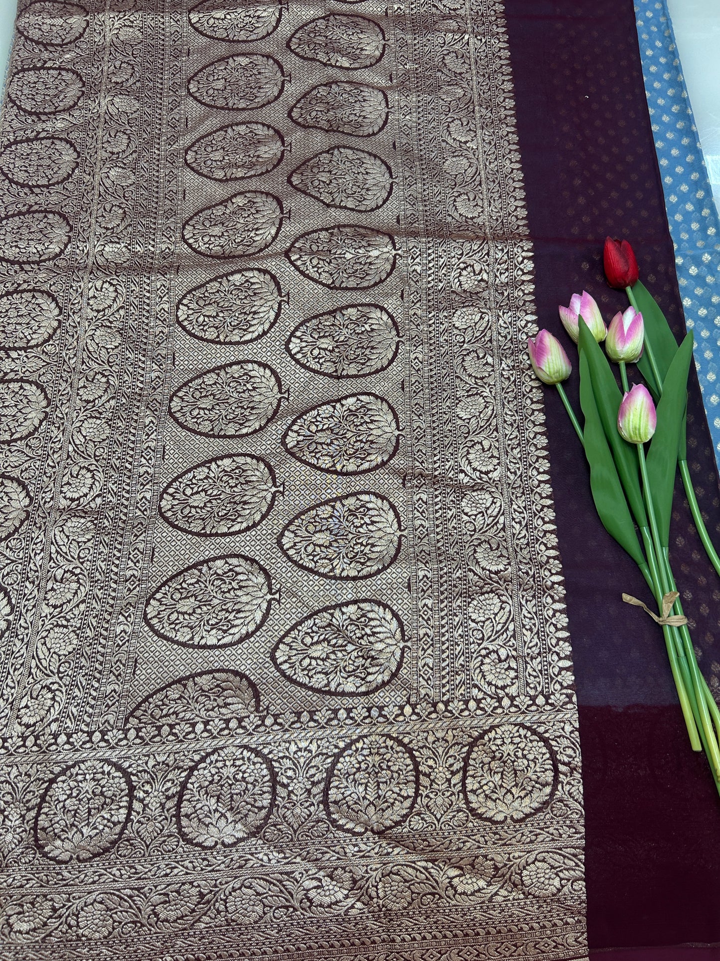 Powder blue Handloom Khaddi Georgette Banarasi Saree with contrast brown blouse
