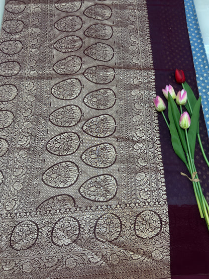 Powder blue Handloom Khaddi Georgette Banarasi Saree with contrast brown blouse