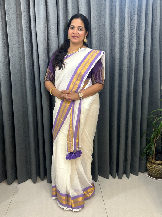 Creamish white Mulcotton saree with purple border with golden zari stripes SMC229