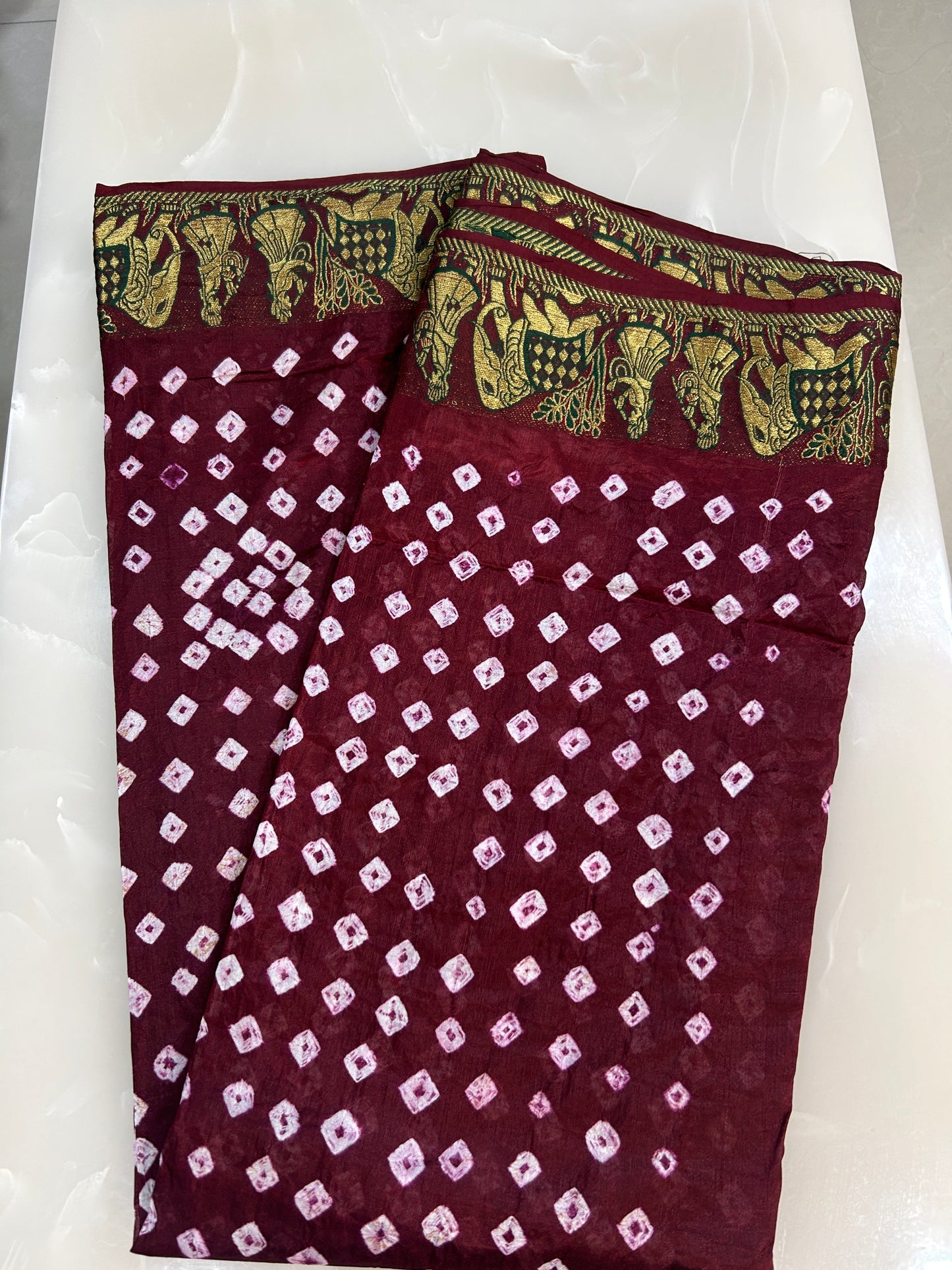 Maroon color Bandini saree with woven figure motifs all over the borders with plain blouse  piece SB207