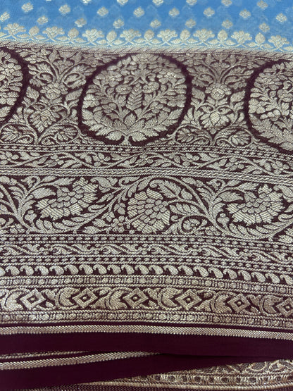 Powder blue Handloom Khaddi Georgette Banarasi Saree with contrast brown blouse