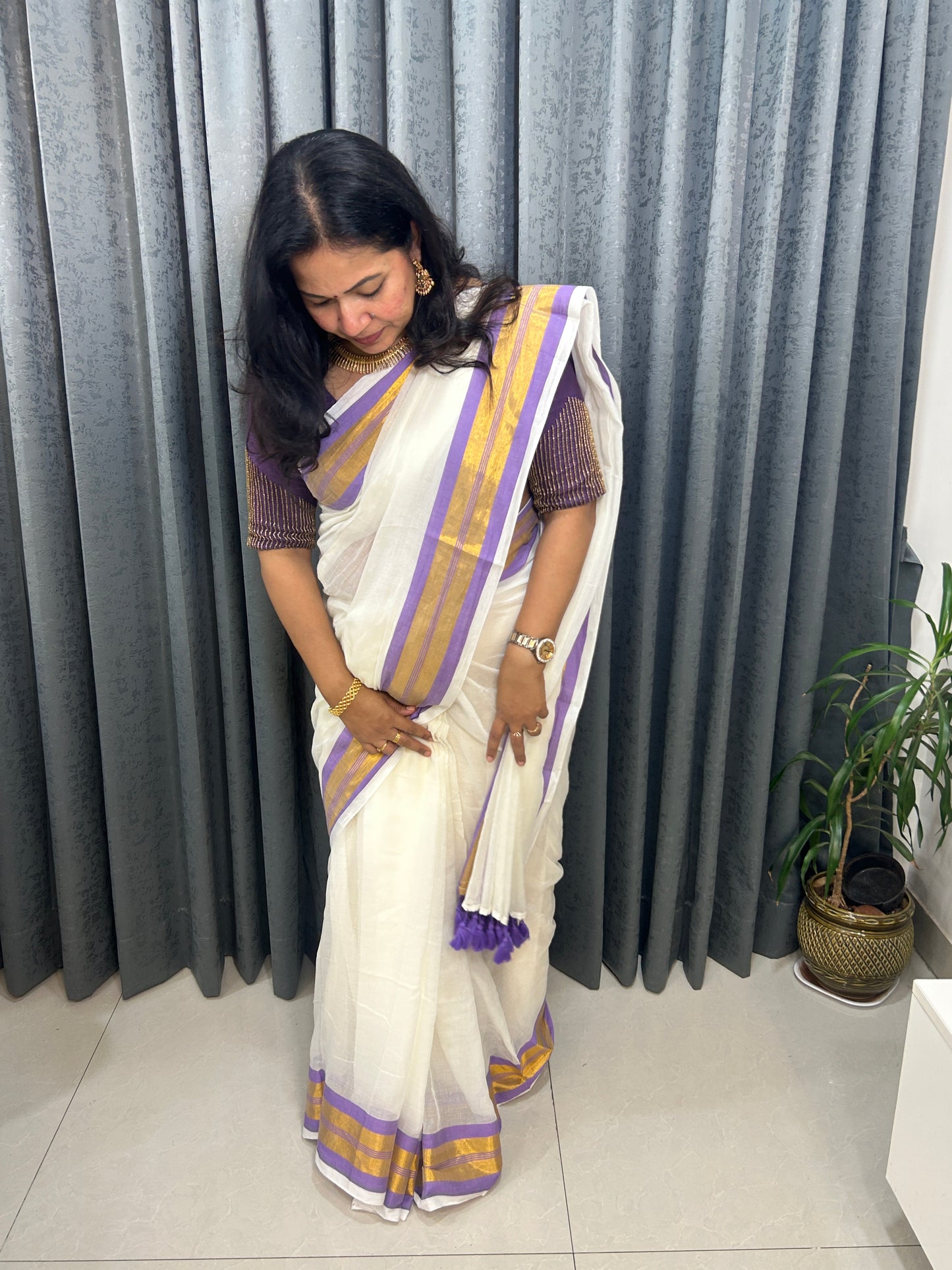 Creamish white Mulcotton saree with purple border with golden zari stripes SMC229