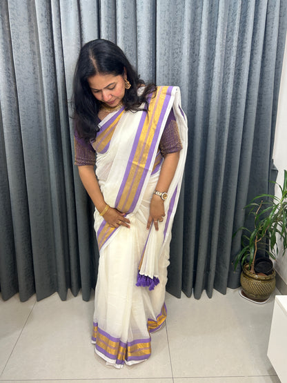 Creamish white Mulcotton saree with purple border with golden zari stripes SMC229