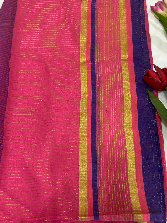 Pink color mulcotton saree with golden lines all over the body and blue and golden striped border SMC235