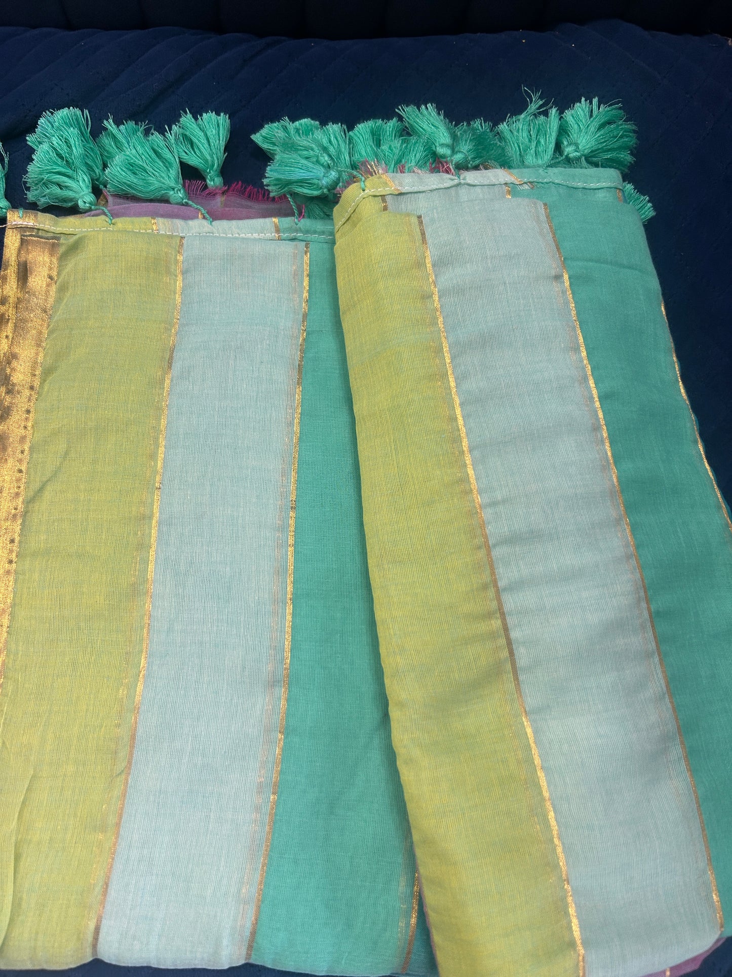 Rainbow mulcotton with light blue and purple stripes all over the body