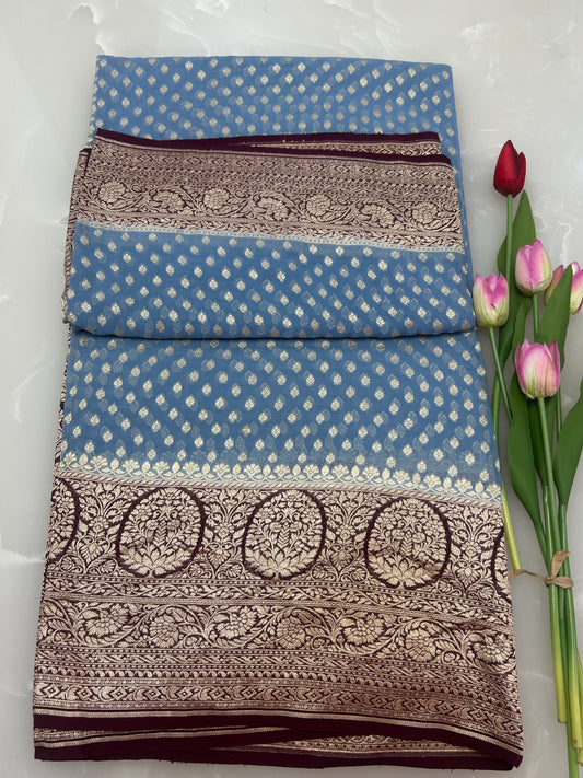 Powder blue Handloom Khaddi Georgette Banarasi Saree with contrast brown blouse