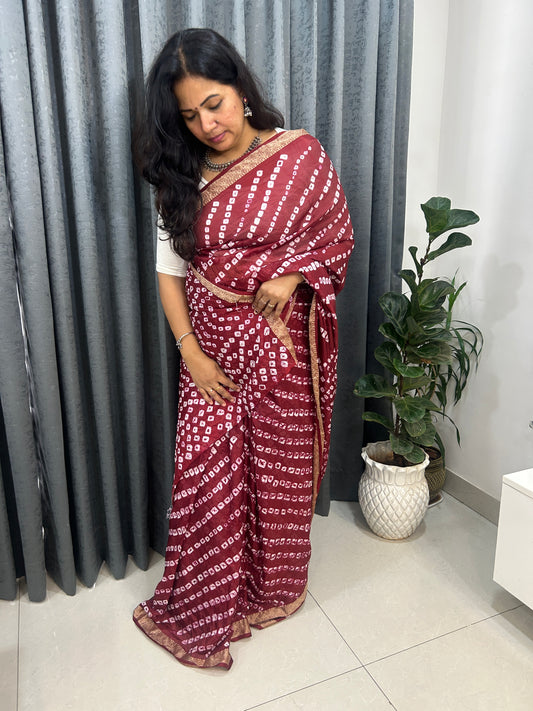 Maroon Bandhani Saree with Lehariya pattern and  Zari Border SB191