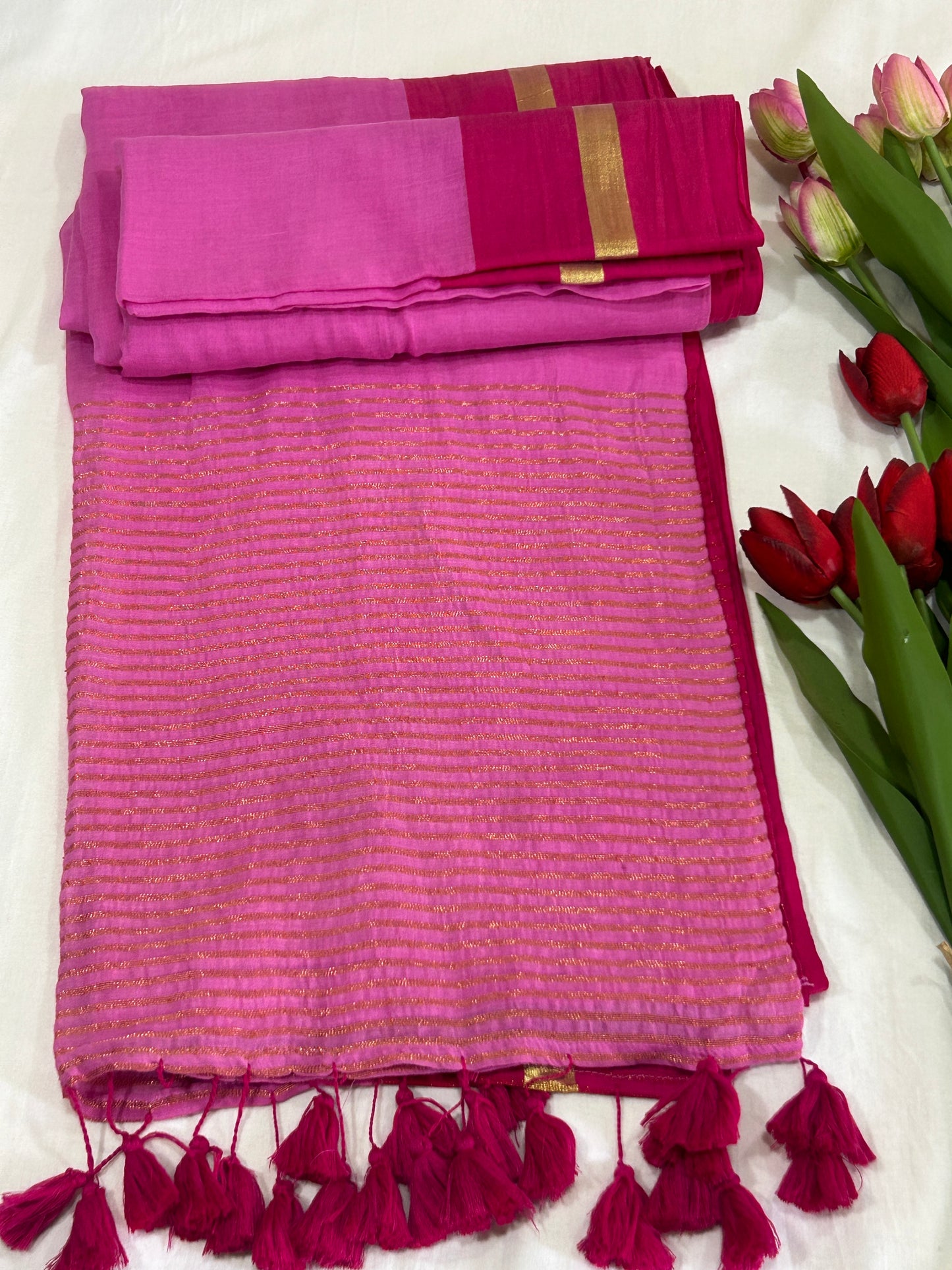 Light Pink mulcotton saree with dark pink with golden stripe border an tassels SMC236