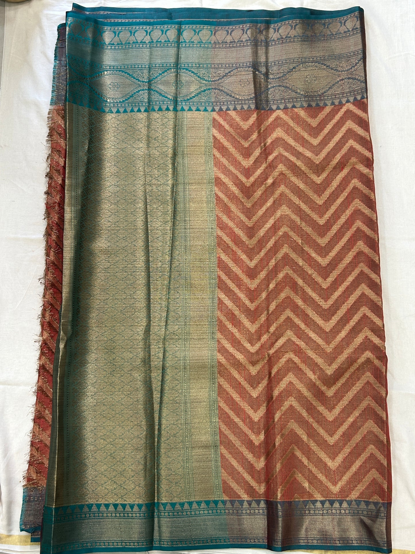 Burnt Orange with Teal blue border with Antique Gold Zari Linen Tissue Banarasi saree with Brocade blouse piece