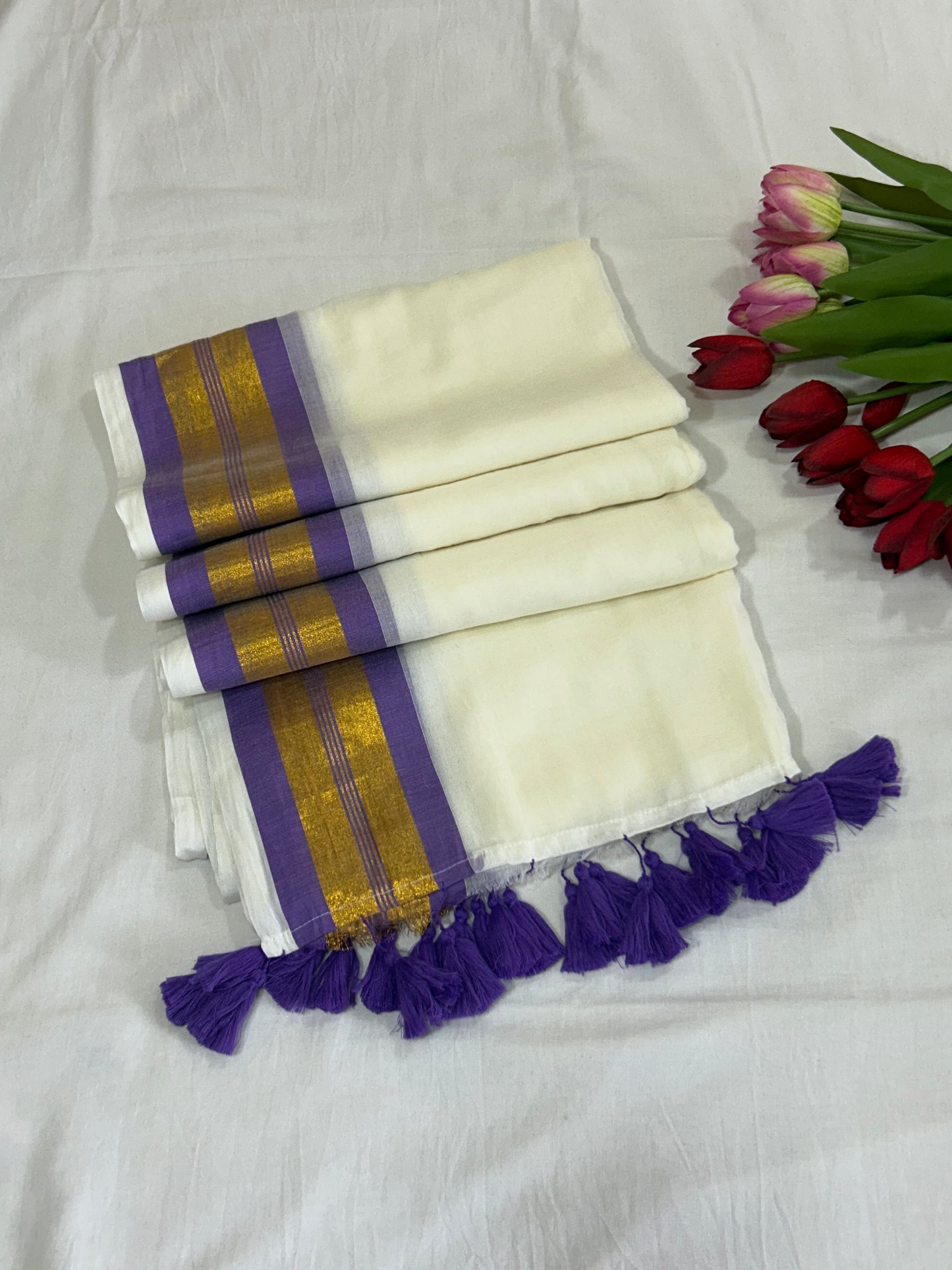 Creamish white Mulcotton saree with purple border with golden zari stripes SMC229
