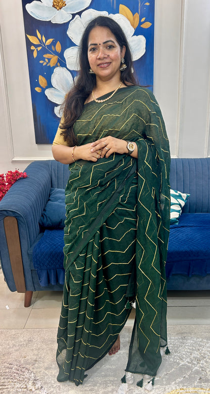Bottle green Mulcotton saree with zig zag golden thread embroidery